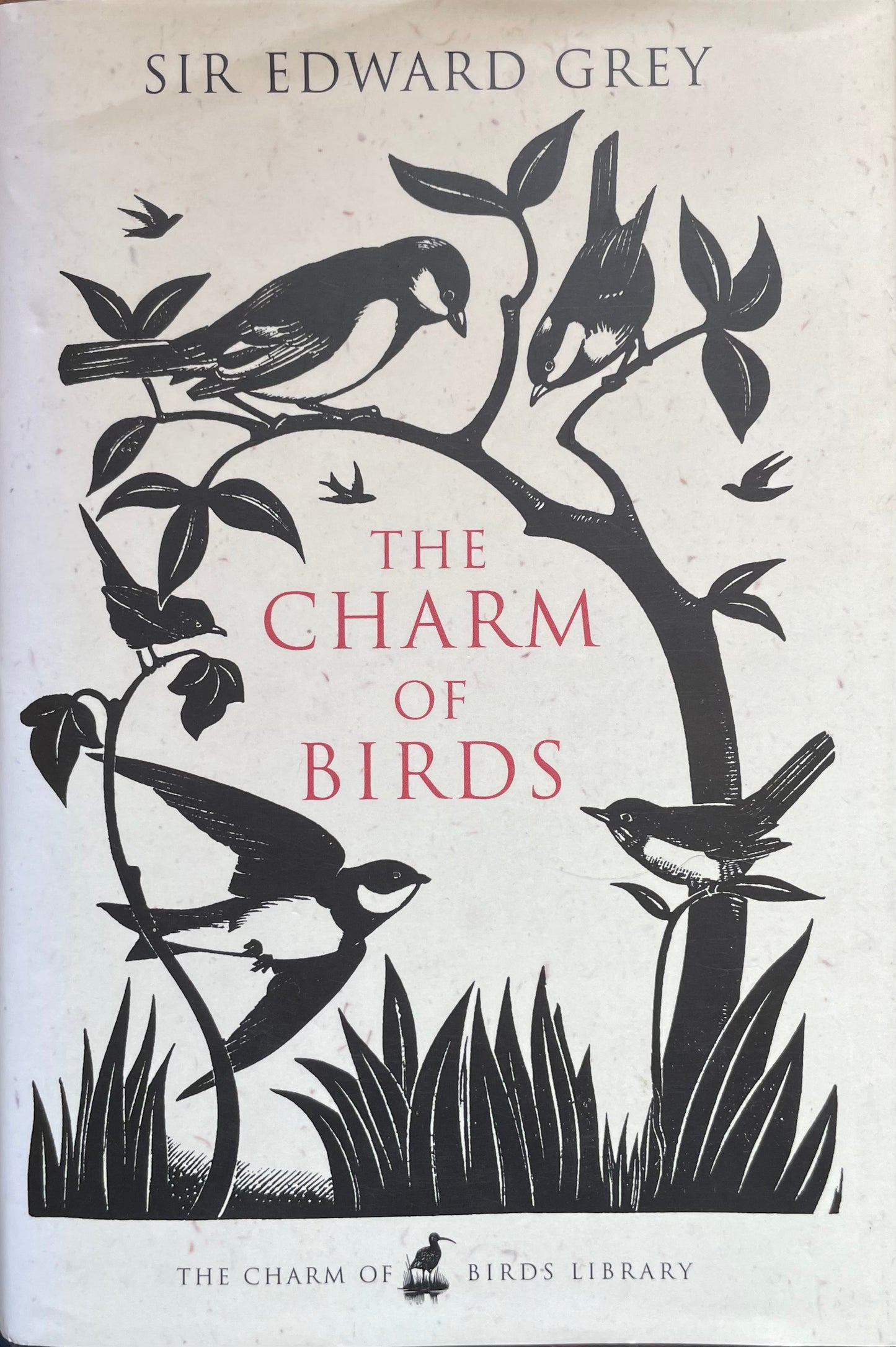 Book cover of 'The Charm of Birds' by Sir Edward Grey with bird illustrations on a white background.